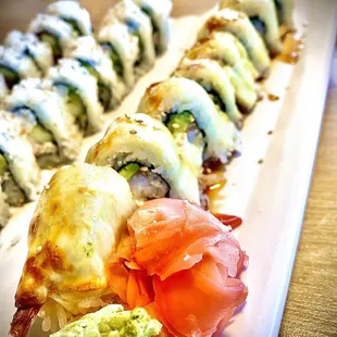 a plate of sushi rolls