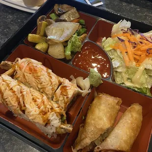 Sushi bento box with Thai roll, Egg Roll, and Hibachi Vegetables