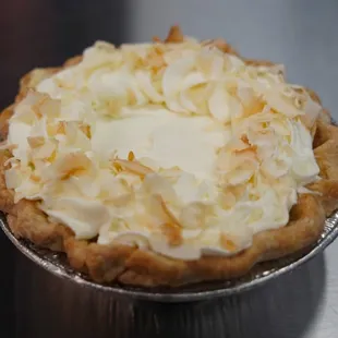 a pie topped with coconut flakes