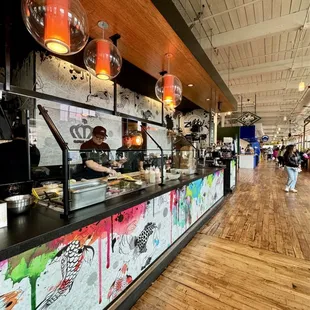 a view of a restaurant with a long counter