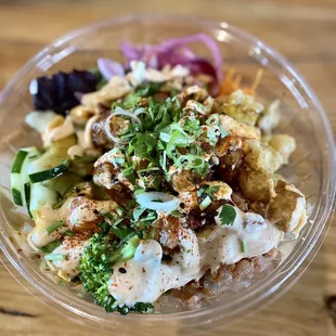 a close up of a salad in a plastic bowl