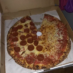 a pepperoni pizza in a box