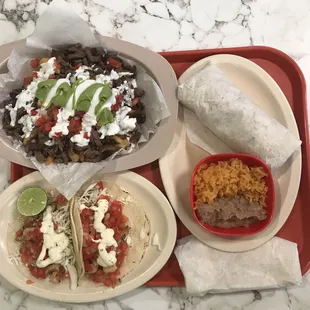 Carne Asada Fries Carne Asada Burrito side Of rice and beans Shrimp Tacos