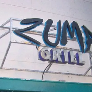 a neon sign on the side of a building