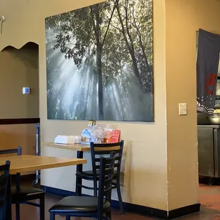 a dining area with tables and chairs