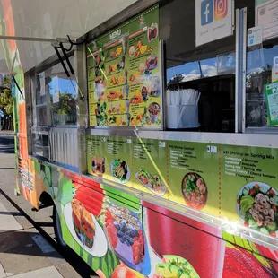 a food truck parked on the side of the road