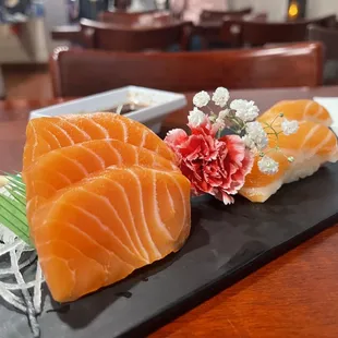 Fresh Sashimi (only fish) Salmon and Nigiri salmon with a ball of rice under