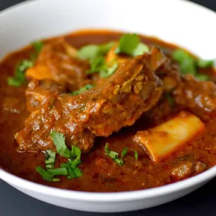 a bowl of stew with meat and vegetables