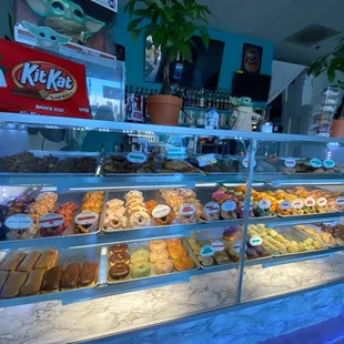 a variety of donuts in a display case