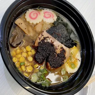 a bowl of ramen and poke