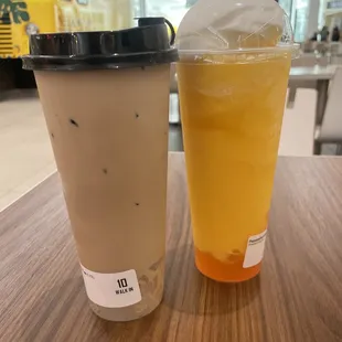 Milk tea with lychee jelly and passion fruit with mango boba.