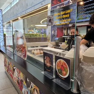 a woman behind the counter