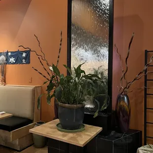 a living room with orange walls