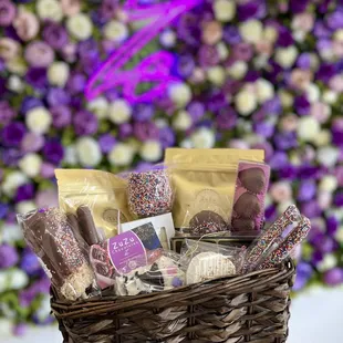 a person holding a basket of treats
