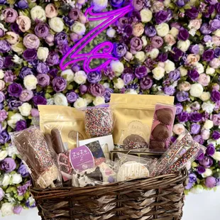 a person holding a basket of treats
