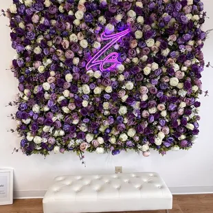 purple and white flowers on a wall