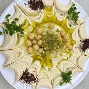 a plate of hummusle and chickpeas