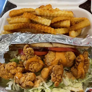 Regular alligator poboy with Cajun fries