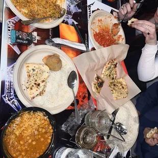 Chan a masala bottom left, Lamb biryani top left and butter chicken top right