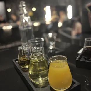 a variety of drinks on a tray