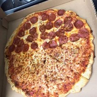 a pepperoni pizza in a box