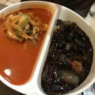 a bowl of soup and a plate of noodles