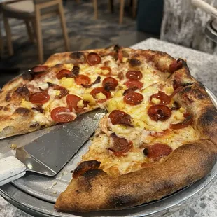 Create your own pizza with pepperoni, bacon, hot honey, and pineapple (don't judge me)