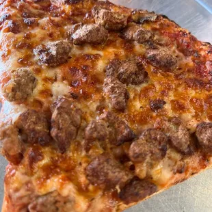 Slice pizza.  Big slice and beer is $8.99