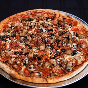 a pizza with mushrooms and olives