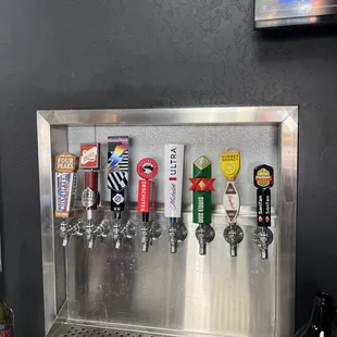 a row of beer taps