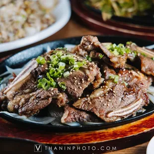 a plate of meat and rice